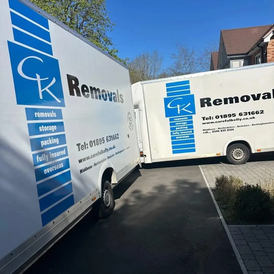Careful Kelly Removals branded vans on a commercial relocation job