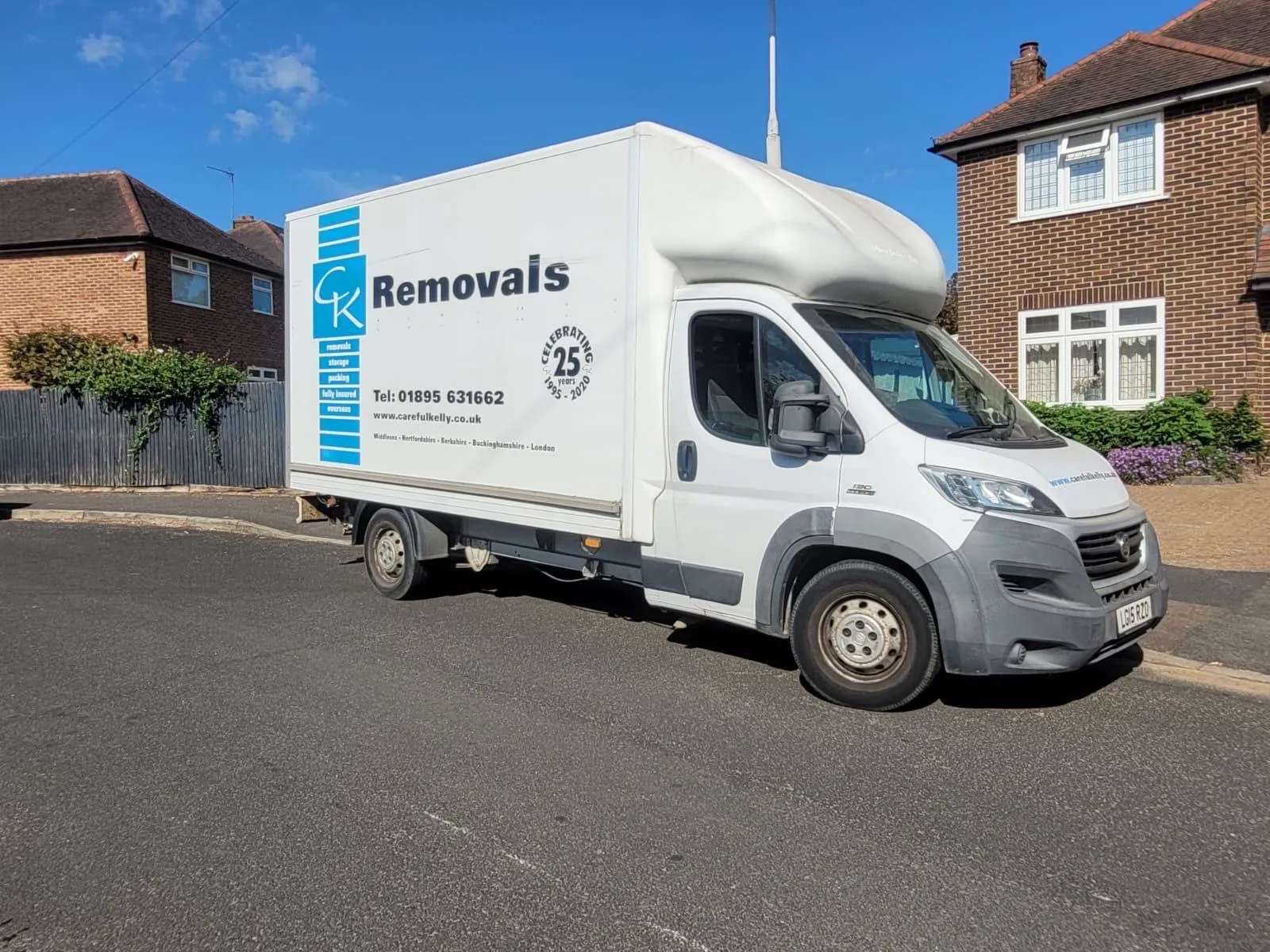 Careful Kelly Removals branded van parked outside a home, ready to serve the local area