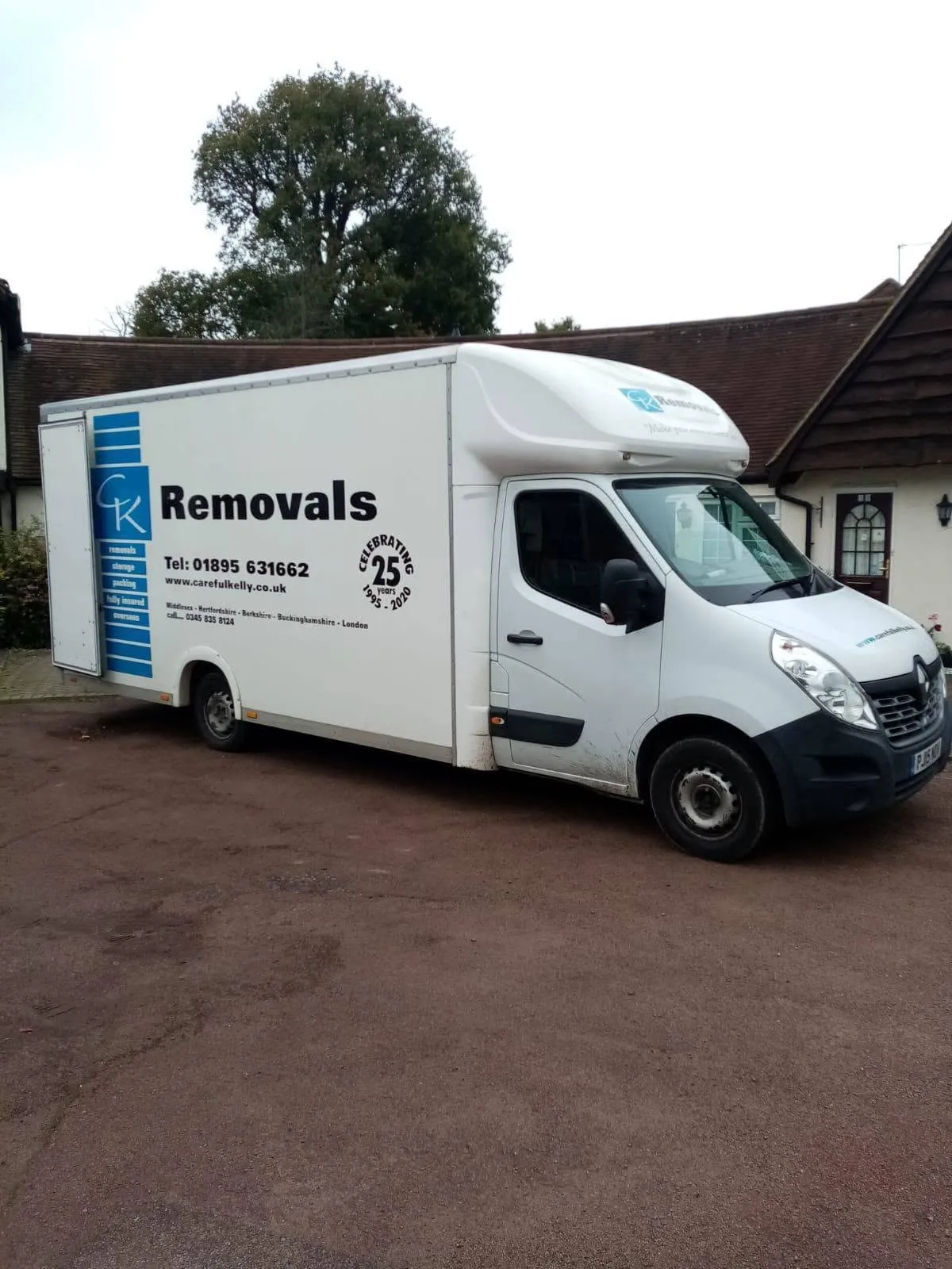 Careful Kelly Removals branded van outside a home